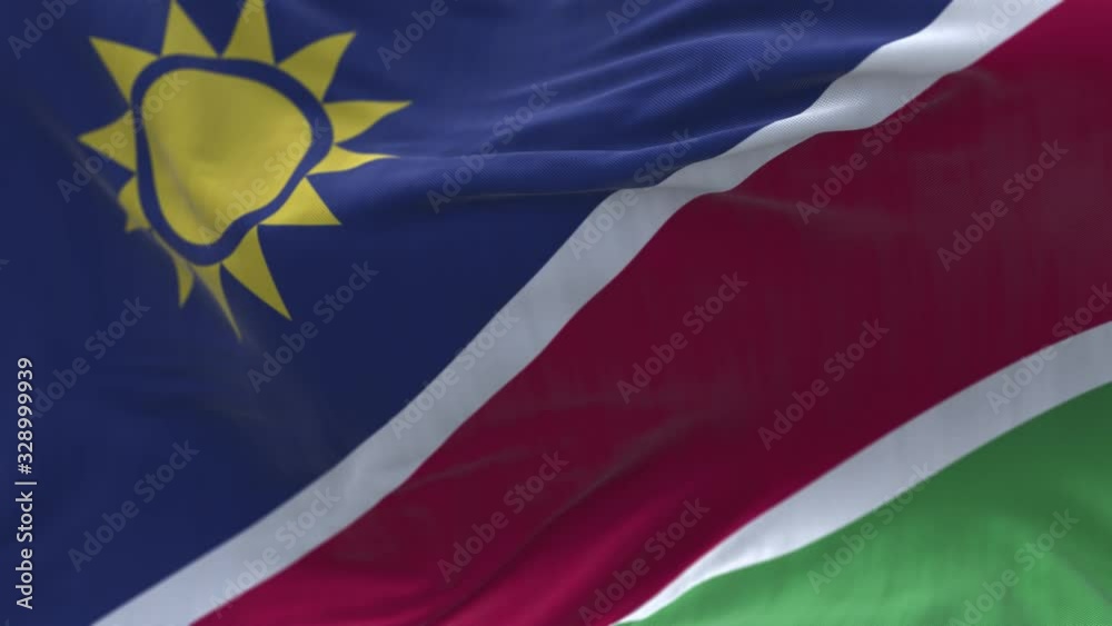 4k Namibia National flag slow loop seamless waving with visible wrinkles in wind blue sky background.A fully digital rendering;animation loops at 20 seconds.
