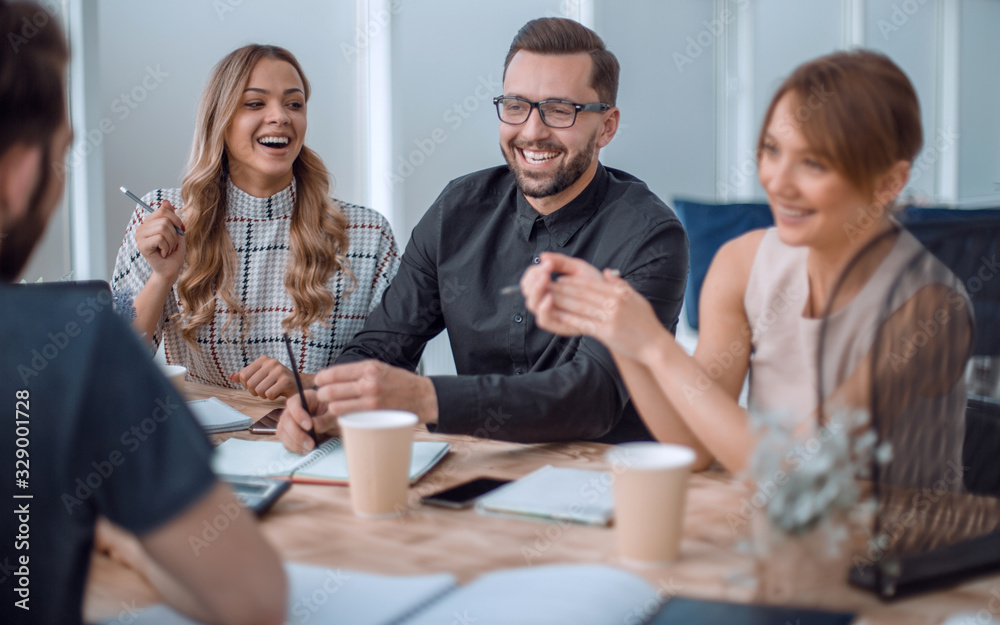 business team discussing business issues over a Cup of coffee business team discussing business issues over a Cup of coffee