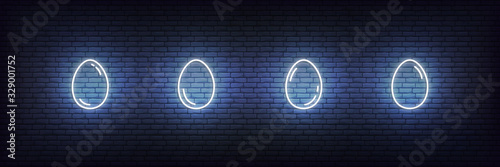 Easter eggs neon set. Glowing white linear eggs icons