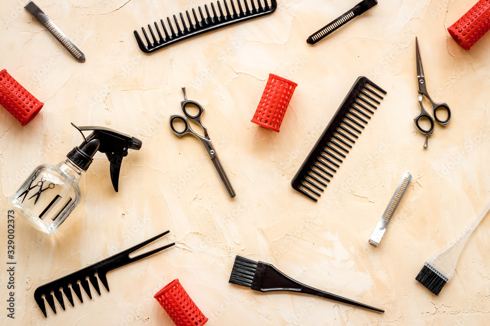 Hairdresser tools pattern on beige background top-down Hairdresser tools pattern on beige background top-down