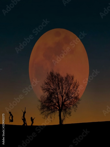 Children playing under the moon