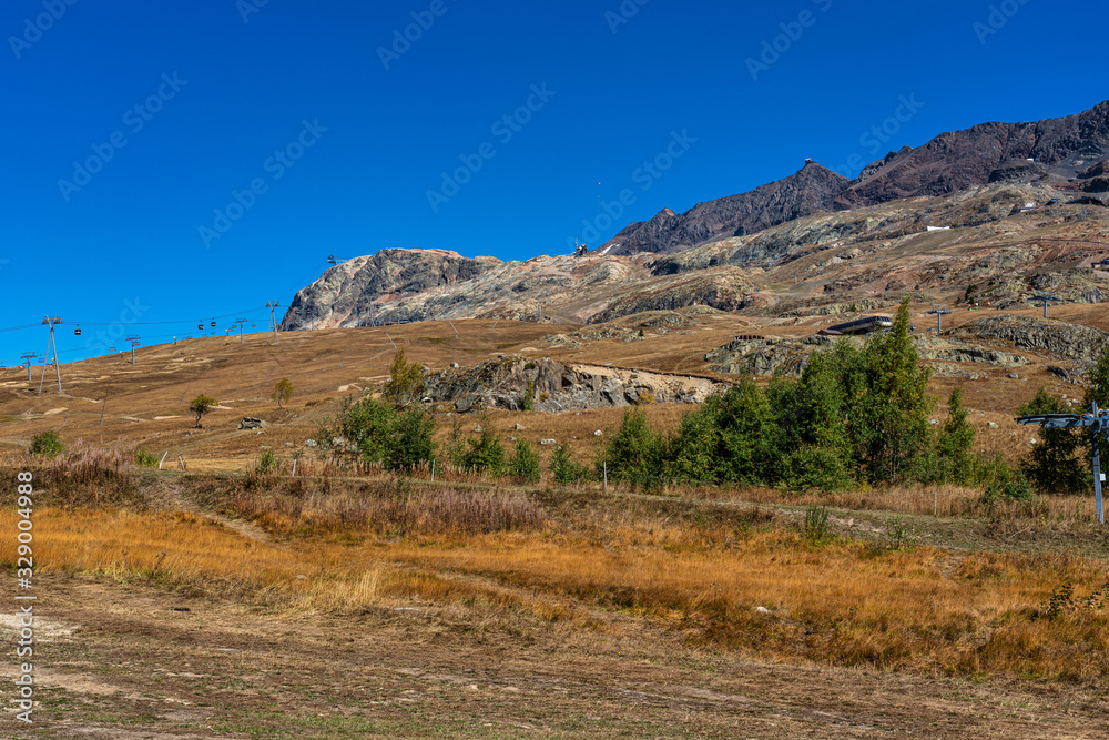 View of the mountains around Alpe d'Huez in the french Alps, France View of the mountains around Alpe d'Huez in the french Alps, France