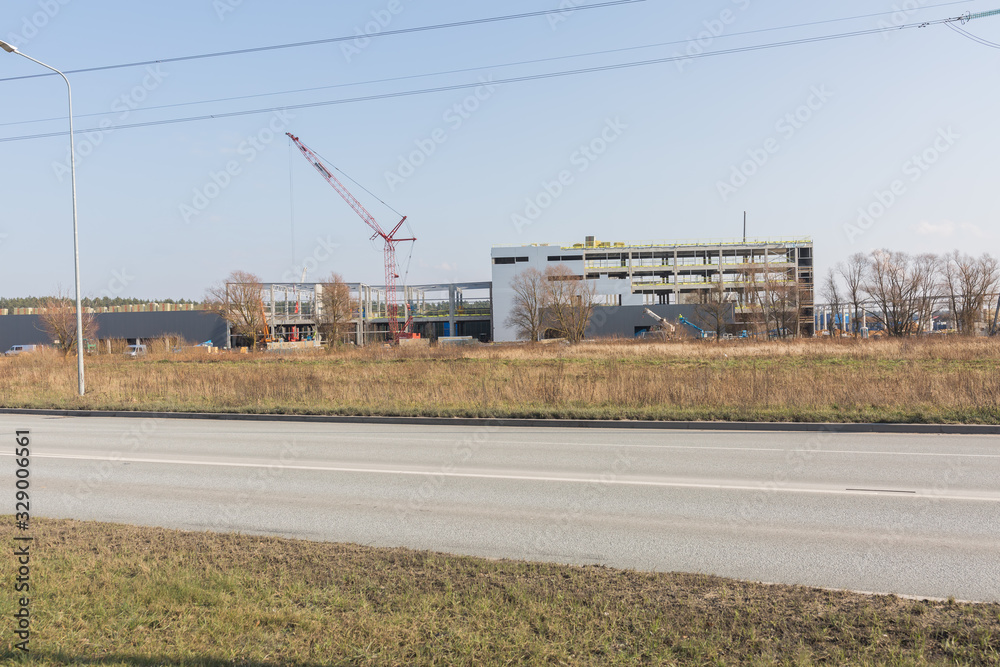 City Riga, Latvia. A large building is being built, transport and structures are visible. City Riga, Latvia. A large building is being built, transport and structures are visible.