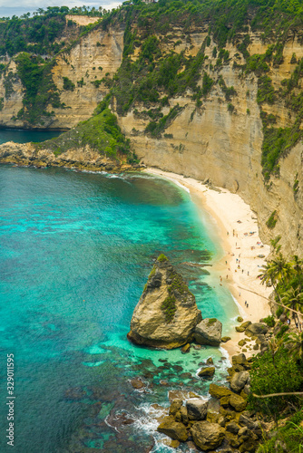 beautiful aerial view of tropical paradise beach and rock cliff with amazing turquoise sea water and palm trees in Summer holidays travel destination and exotic vacations trip