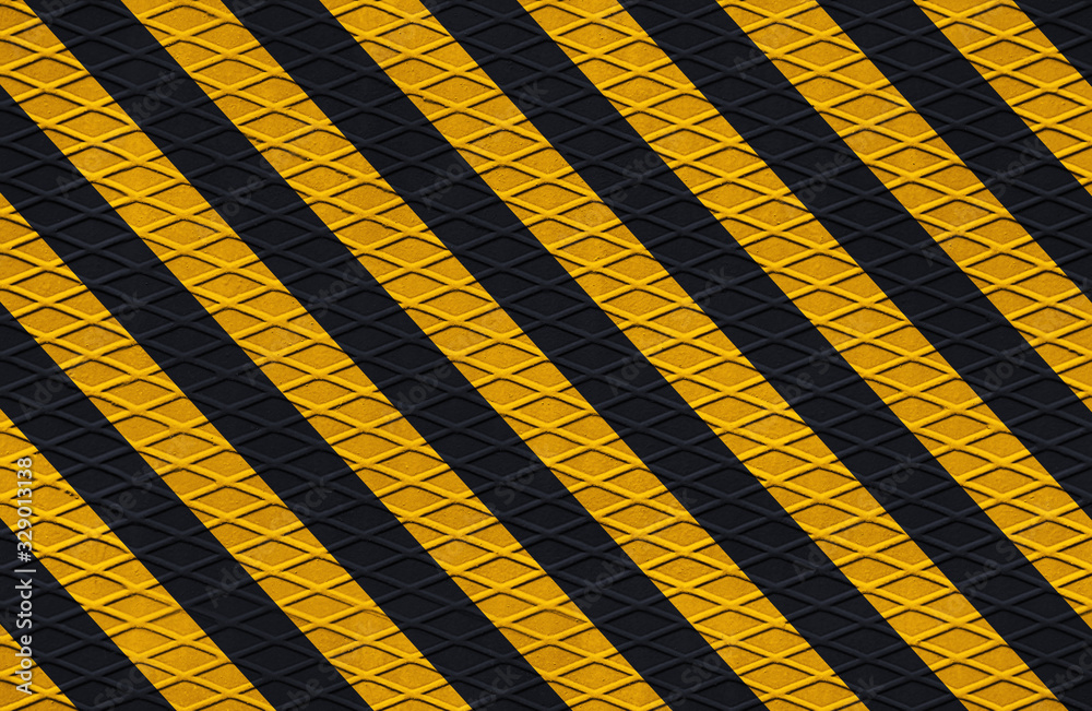 black and yellow safety hazard attention warning stripes on diamond metal texture black and yellow safety hazard attention warning stripes on diamond metal texture