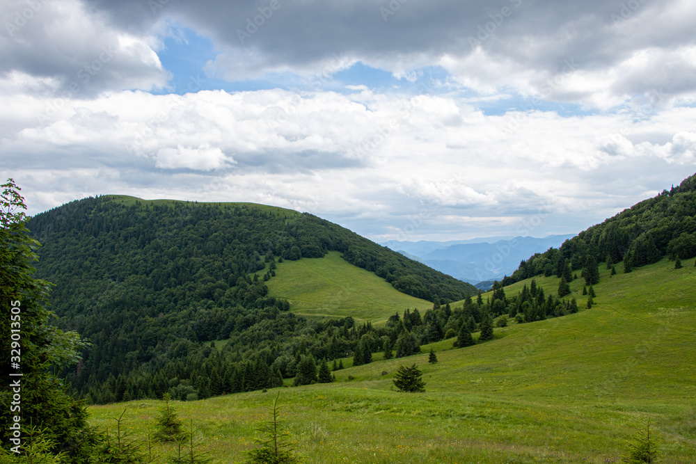 Mountain landscape with meadows, forest, hills and blue sky, Northern Slovakia
