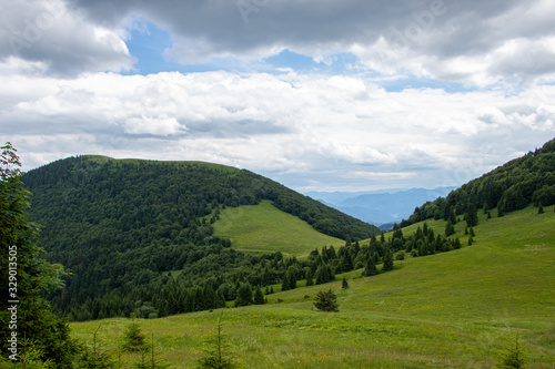 Fototapeta Naklejka Na Ścianę i Meble -  Mountain landscape with meadows, forest, hills and blue sky, Northern Slovakia