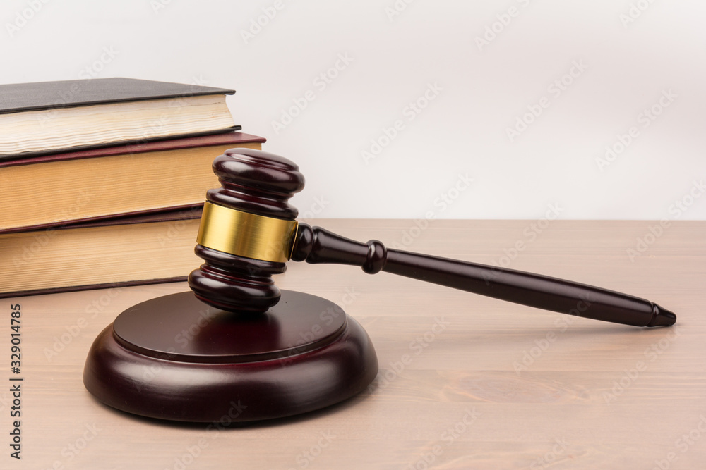 Wooden judges gavel on wooden table, close up. Space for text Wooden judges gavel on wooden table, close up. Space for text