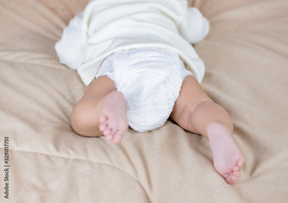 Ass baby in cotton panties on bed Stock Photo
