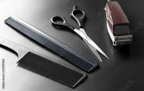 Hair cutting tools on a black background