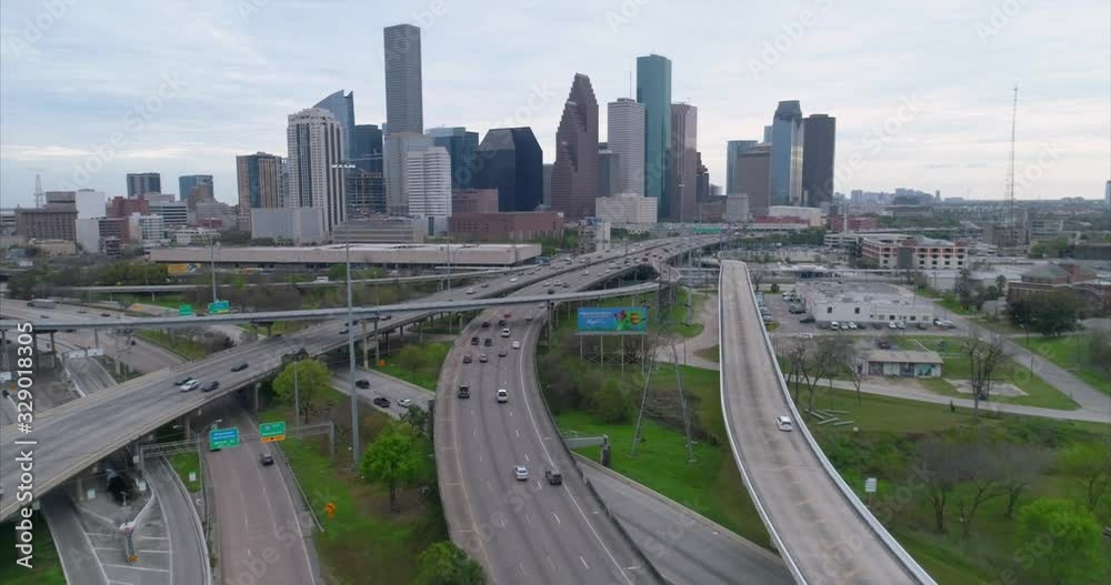 Aerial view of traffic on freeway near downtown Houston on a cloudy day during sunset. This video was filmed in 4k for best image quality. Aerial view of traffic on freeway near downtown Houston on a cloudy day during sunset. This video was filmed in 4k for best image quality.