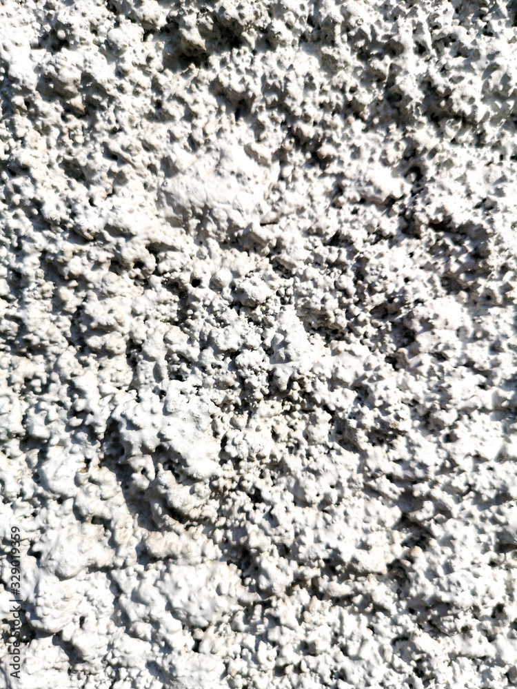 Concrete chips on the wall as abstract background
