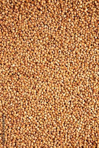 Uncooked Roasted Buckwheat  overhead view. Flat lay  top view.