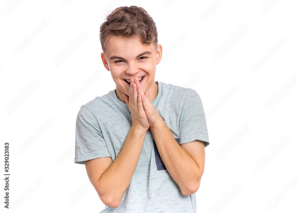 Portrait of happy teen boy, isolated on white background. Photo of adorable young smiling child having fun and looking at camera, front view. Laughing child touches face with his hands. Portrait of happy teen boy, isolated on white background. Photo of adorable young smiling child having fun and looking at camera, front view. Laughing child touches face with his hands.