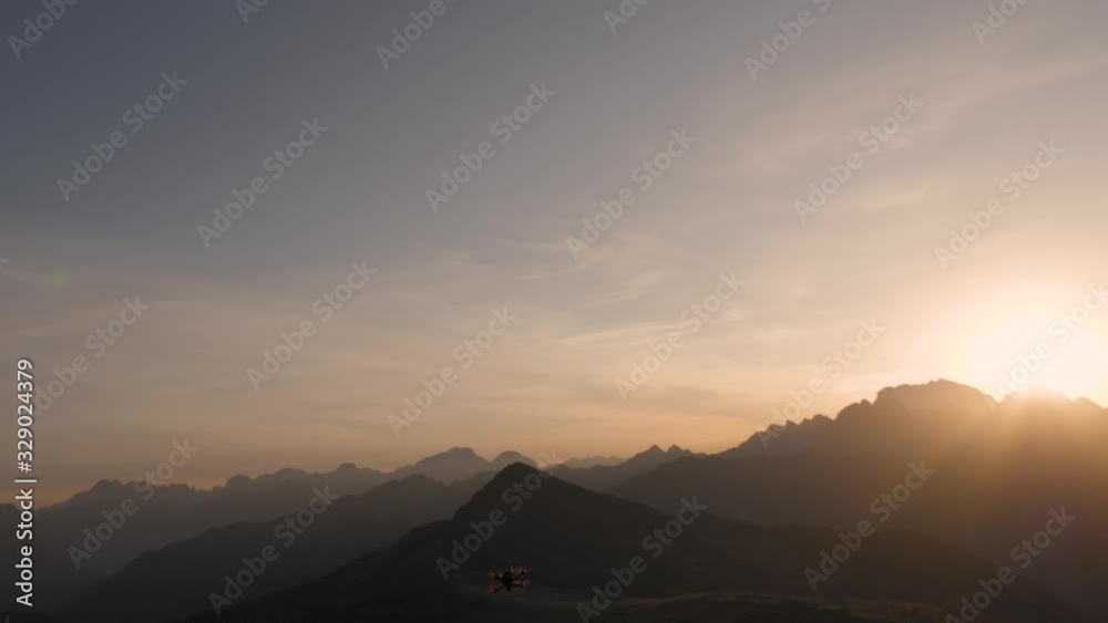 An fpv racing drone quadcopter taking off to film epic aerial footage at sunrise flying in Dolomites mountain range of Italy. An fpv racing drone quadcopter taking off to film epic aerial footage at sunrise flying in Dolomites mountain range of Italy.