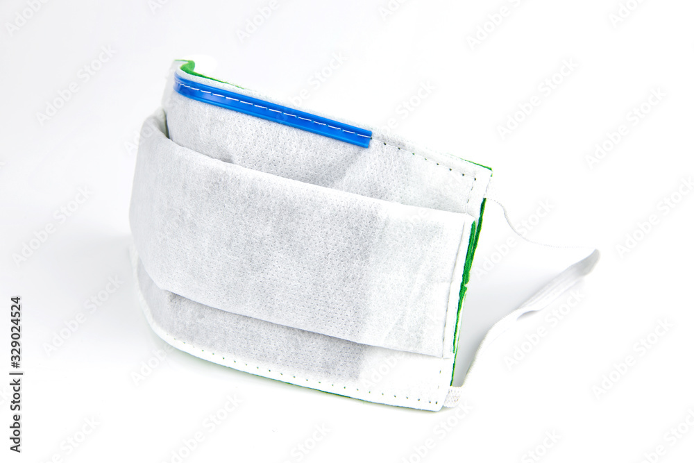 Close up protective activated carbon mask isolated on white background. Procedure mask from bacteria coronavirus disease 2019. Protection concept. Close up protective activated carbon mask isolated on white background. Procedure mask from bacteria coronavirus disease 2019. Protection concept.