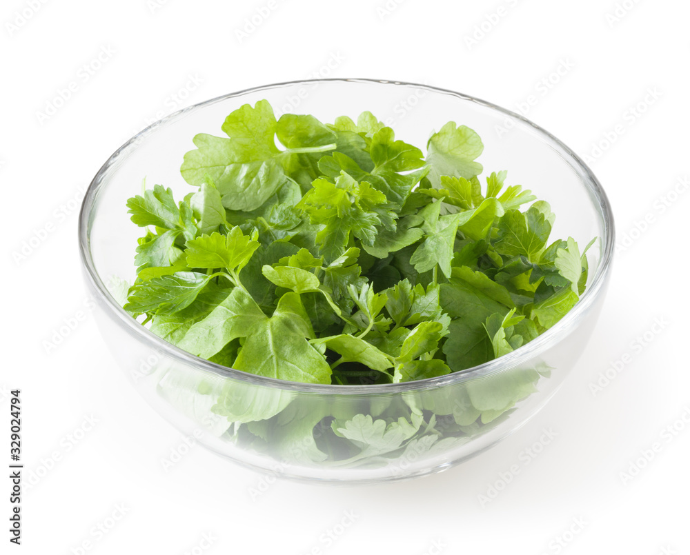 Fresh parsley leaves in glass bowl isolated on white background with clipping path Fresh parsley leaves in glass bowl isolated on white background with clipping path