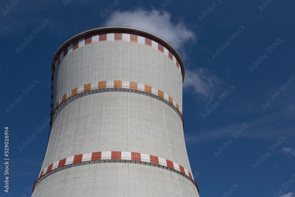 Cooling tower of nuclear power plant against the blue sky Cooling tower of nuclear power plant against the blue sky