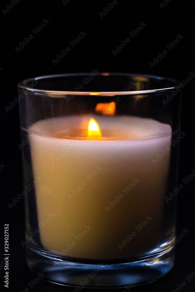 Candle in a glass jar. Sadness, remembrance and condolence concept Candle in a glass jar. Sadness, remembrance and condolence concept