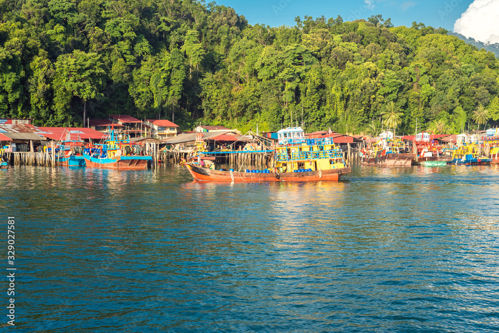 Many fishing trawler are moored in front of the island of Pangkor on the west coast of Malaysia in the Malaysian state of Perak 