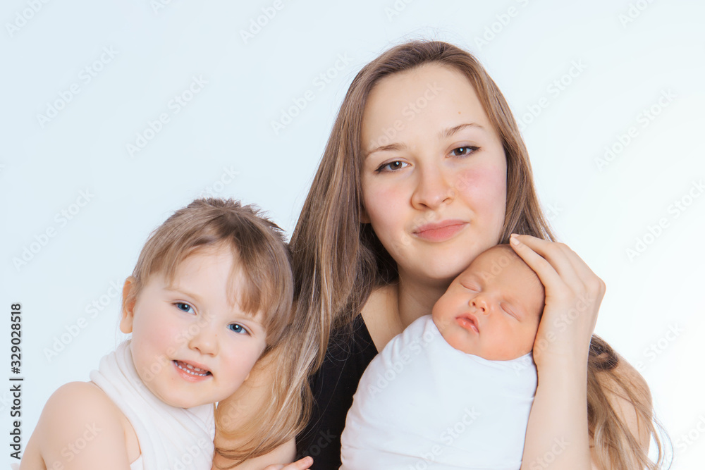 concept of healthy lifestyle, the protection of children, shopping - baby in the arms of the mother. Woman holding a child. Tree girls. Isolated on white background. Copy space. 8 march, mother's day concept of healthy lifestyle, the protection of children, shopping - baby in the arms of the mother. Woman holding a child. Tree girls. Isolated on white background. Copy space. 8 march, mother's day