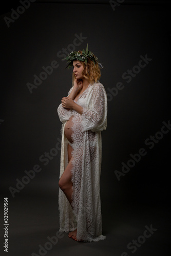 lovely tender portrait of a young beautiful pregnant woman