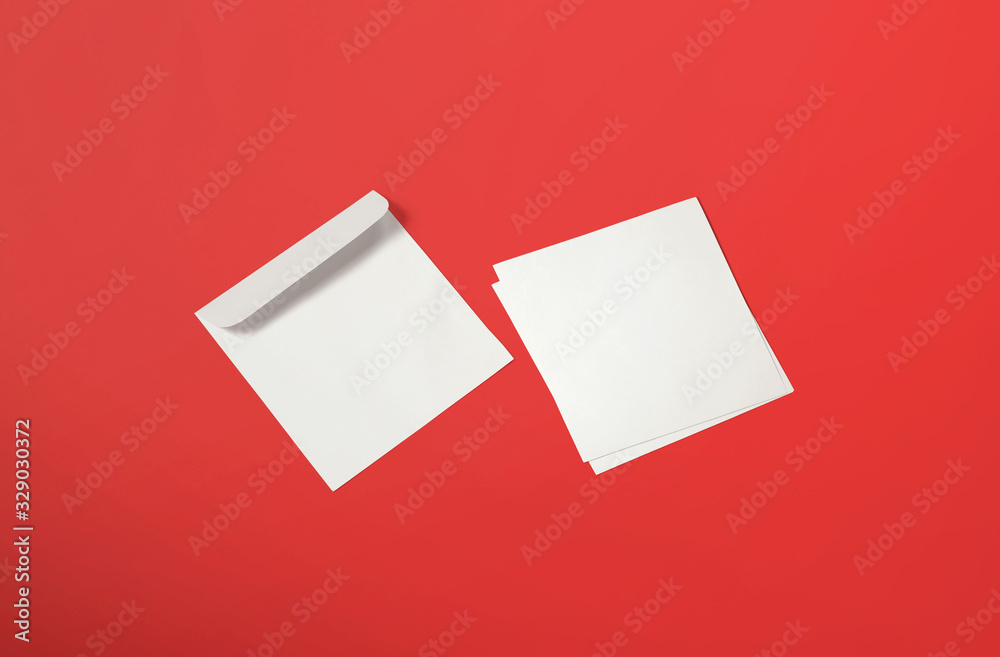 White envelope and post card on background. Top view blank envelope mockup and blank letterhead presentation template. Empty sheet for your design. White envelope and post card on background. Top view blank envelope mockup and blank letterhead presentation template. Empty sheet for your design.