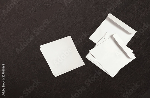 White envelope and post card on background. Top view blank envelope mockup and blank letterhead presentation template. Empty sheet for your design. © Gooder
