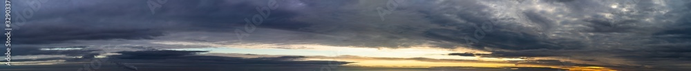 Fototapeta premium Fantastic dark thunderclouds at sunrise