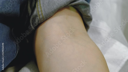 applying a tourniquet and treating the injection field