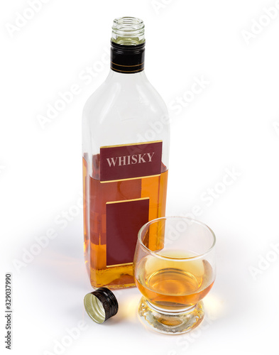 Bottle of whisky and glass whisky on a white background