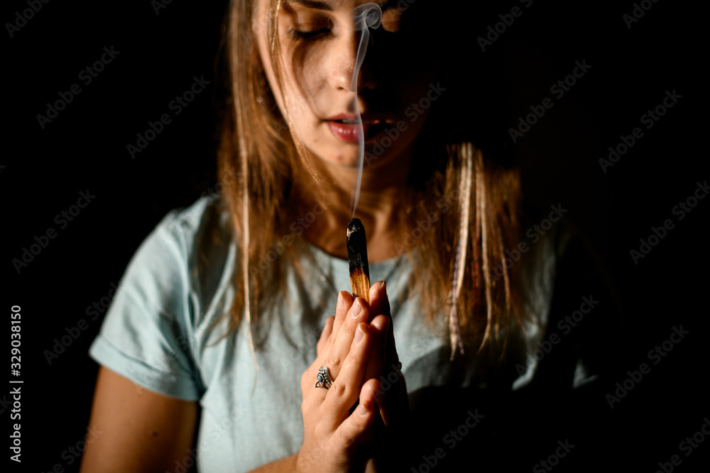 Fototapeta premium Pretty woman hold hands in yoga gesture, with both hands palm to palm.