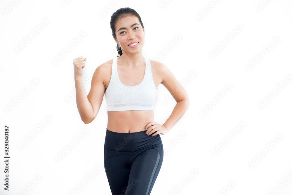 a beautiful asian sporty woman wear black and white outfit standing and posing on white background.fitness lady smile with winning and successful feeling a beautiful asian sporty woman wear black and white outfit standing and posing on white background.fitness lady smile with winning and successful feeling