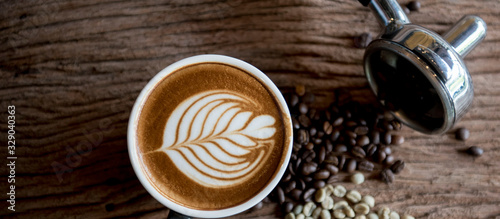 Fototapeta cups of cappuccino with latte art on wooden background,top view,flat lay