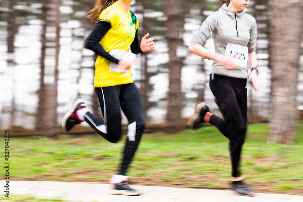Runners in a marathon race in blurred motion