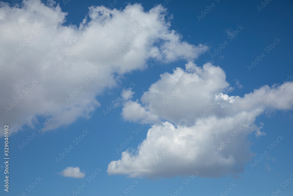 fluffy clouds and blue sky