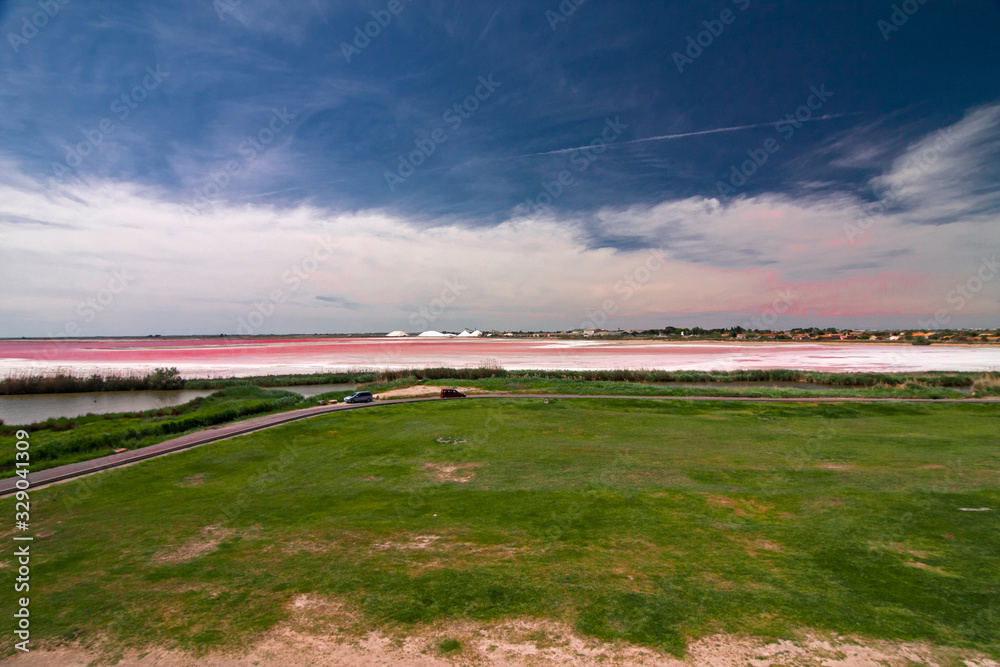 Panoramic view of the ponds and salt flats from the ramparts of the walls, the fortified city of Aigues Mortes, in the Camargue France. Panoramic view of the ponds and salt flats from the ramparts of the walls, the fortified city of Aigues Mortes, in the Camargue France.