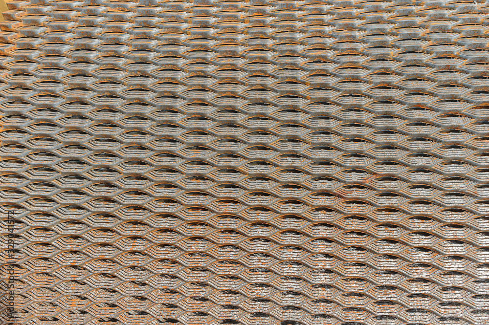 Background close up of rusty steel metal grating net texture structured design. For photo collages Background close up of rusty steel metal grating net texture structured design. For photo collages