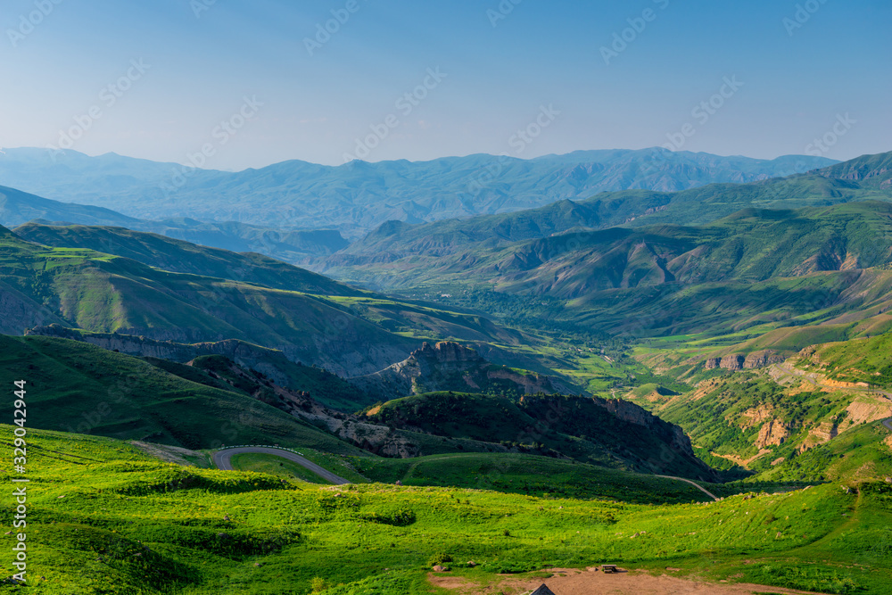 summer landscape overlooking the horizon high mountains of Armenia covered with grass