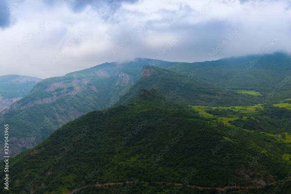 Beautiful tall and picturesque mountains of Armenia on a cloudy summer day