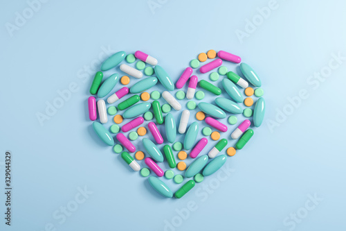 Abstract color capsule medication in form heart