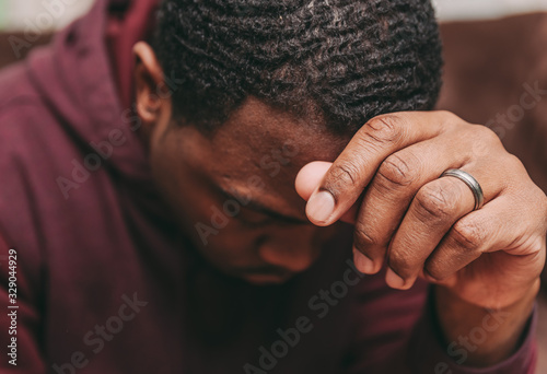 Fotografie, Obraz black african american man depicting a sad depressive state, depression concept