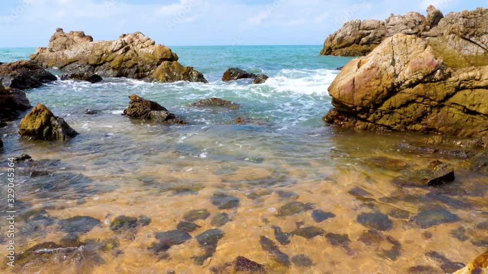 rocky coast of the ocean in sunny day rocky coast of the ocean in sunny day