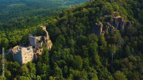 Aerial view of the castle Burg Hohenbaden in Germany beside Baden-Baden on a sunny morning in summer. Pan to the left from the chapel to the castle. photo