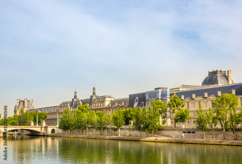 Seine River Embankment and the Louvre Museum Façade