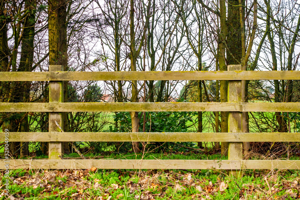 wooden fence over park or golf club in england uk