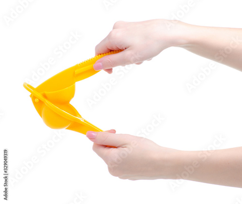 Hand holding lemon squeezer juicer juicy on white background isolation