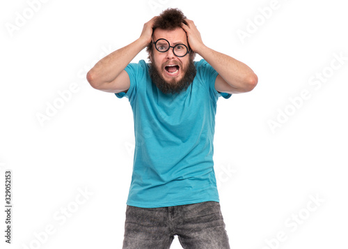 Crazy Scared or Surprised Man with funny Curly Hair in eye Glasses, looks worried. Bearded guy afraid and shocked, isolated on white background. Emotions and signs concept.