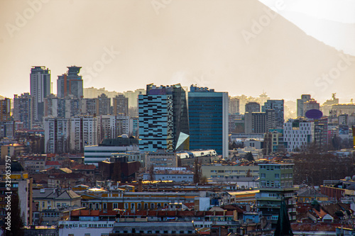 View to the Sarajevo city center and the parliament building in city of Sarajevo Bosnia and Herzegovina durring a foggy day photo