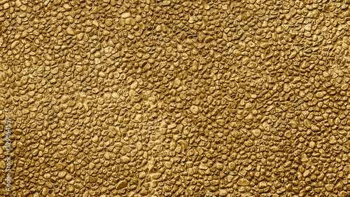 Golden pattern. Golden background and texture. Yellow gravel. Stone wall